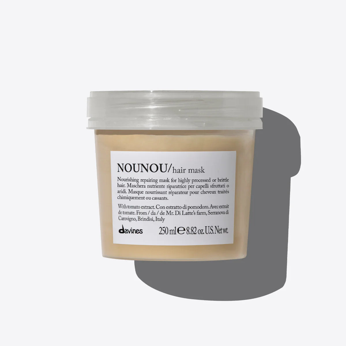 A clear plastic jar containing Davines Nounou hair mask with a label on the front.